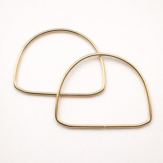 Asas semicircular metálicas doradas – 14 cm (par)